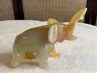 Left side profile of onyx elephant figurine