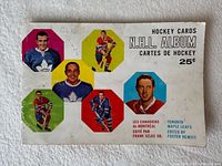 Front cover showing title, player photos, handwriting and wear