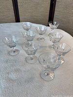 Full set of nine Waterford Sheila crystal champagne coupes on surface