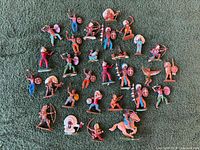 Full lot overview showing approximately 30 hand-painted western figures