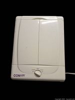 Mirror closed showing Conair logo and white plastic exterior