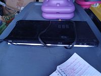 Top view of JVC Blu-ray player with cable resting on unit