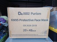 Front of outer carton showing brand, model, quantity and standard