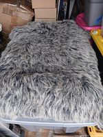 Top view showing long-pile gray and black faux fur surface