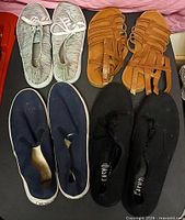 All four pairs of shoes arranged together