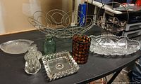 Group overview of all glass pieces and wire baskets