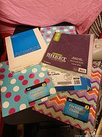 All items grouped: three Jot file folder packs, sheet protectors, transparency film, address labels