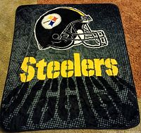 Full view of Pittsburgh Steelers fleece throw blanket showing helmet graphic and team name