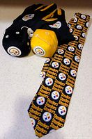 Full lot showing tie, gloves and both plush dice