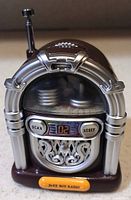 Front view showing jukebox design, display, buttons