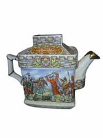 Front view of Sadler square castle-form teapot showing multicolor Jacobite scene and gold-tipped spout