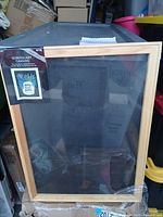 Front view of sealed screen art canvas in natural wood frame