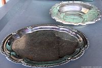 Both silver-plated pieces showing overall design and size relation