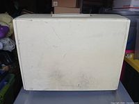 Hard plastic carrying cover exterior showing scuffs