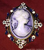 Front view showing cameo, enamel flowers, rhinestones