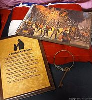 Overview of all three items: poem plaque, fire scene print, skeleton key on ring