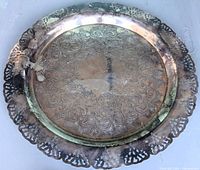 Top view showing engraved floral design and pierced border
