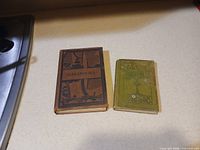 Front covers of both hardcovers side by side