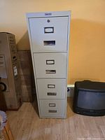 Full view of four-drawer metal filing cabinet