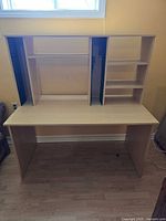 Overall view of desk with hutch showing CD racks, shelves and finish