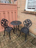 Full view of metal bistro set outdoors