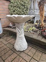 Front view of entire bird bath showing pedestal and bowl