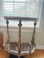 Full view of two-tier stone and metal side table