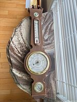 Front view showing all three gauges on banjo-style body