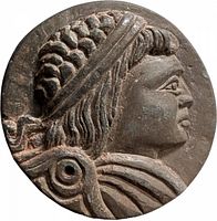 Obverse showing Athena profile, hole visible