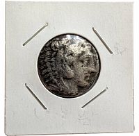 Obverse of Mercury dime showing worn design in cardboard flip