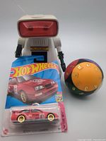 Robot figure, sealed Hot Wheels car, puzzle ball