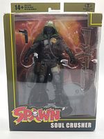 Front view of boxed Soul Crusher action figure showing figure and accessories
