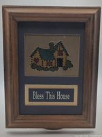 Full framed artwork showing punched-tin cottage and Bless This House plaque