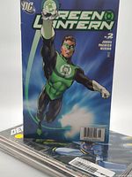 Front cover Green Lantern #2 standing on stack of comics