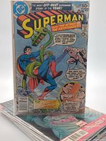 Superman issue standing on stack