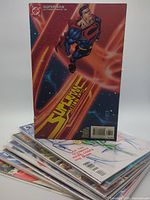 Stack of comics with Superman Action Comics on top