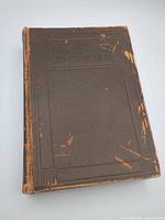 Front cover showing title embossing and wear