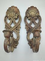 Front view of both ornate gold Homco wall sconces