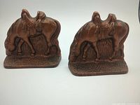 Front view of both cast iron grazing horse bookends