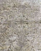 Full view of central medallion and floral motifs on acid-washed rug