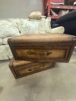 Front view showing two stacked drawers with suitcase handles and metal latches