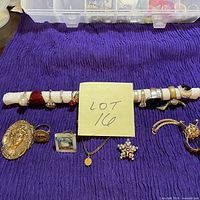 Overview of rings on tube with pins and glove clip below