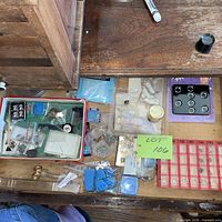 Drawer overview with rings tray, loupe, assorted items