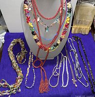 All necklaces displayed on bust and cloth