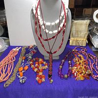Group overview showing all seven necklaces displayed