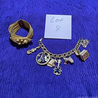 overview of both bracelets on fabric background