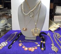 Overall lot with necklaces on bust and cloth