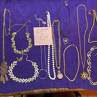 Group overview of all necklaces and bracelet on purple background