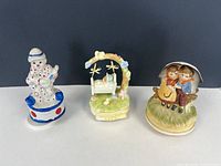 All three ceramic music boxes side by side