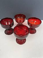 Front view of all four ruby red dessert dishes